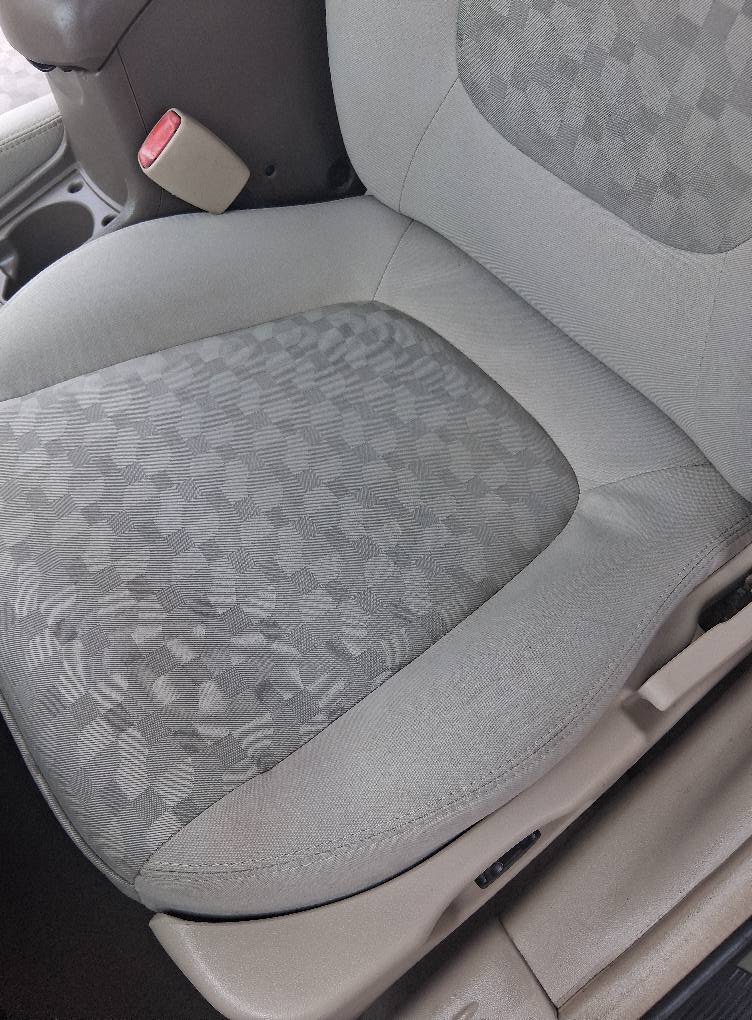 Clean car seat upholstery after professional detailing