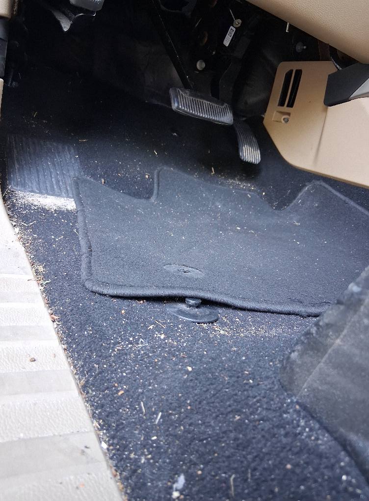 Stained car carpet before professional cleaning