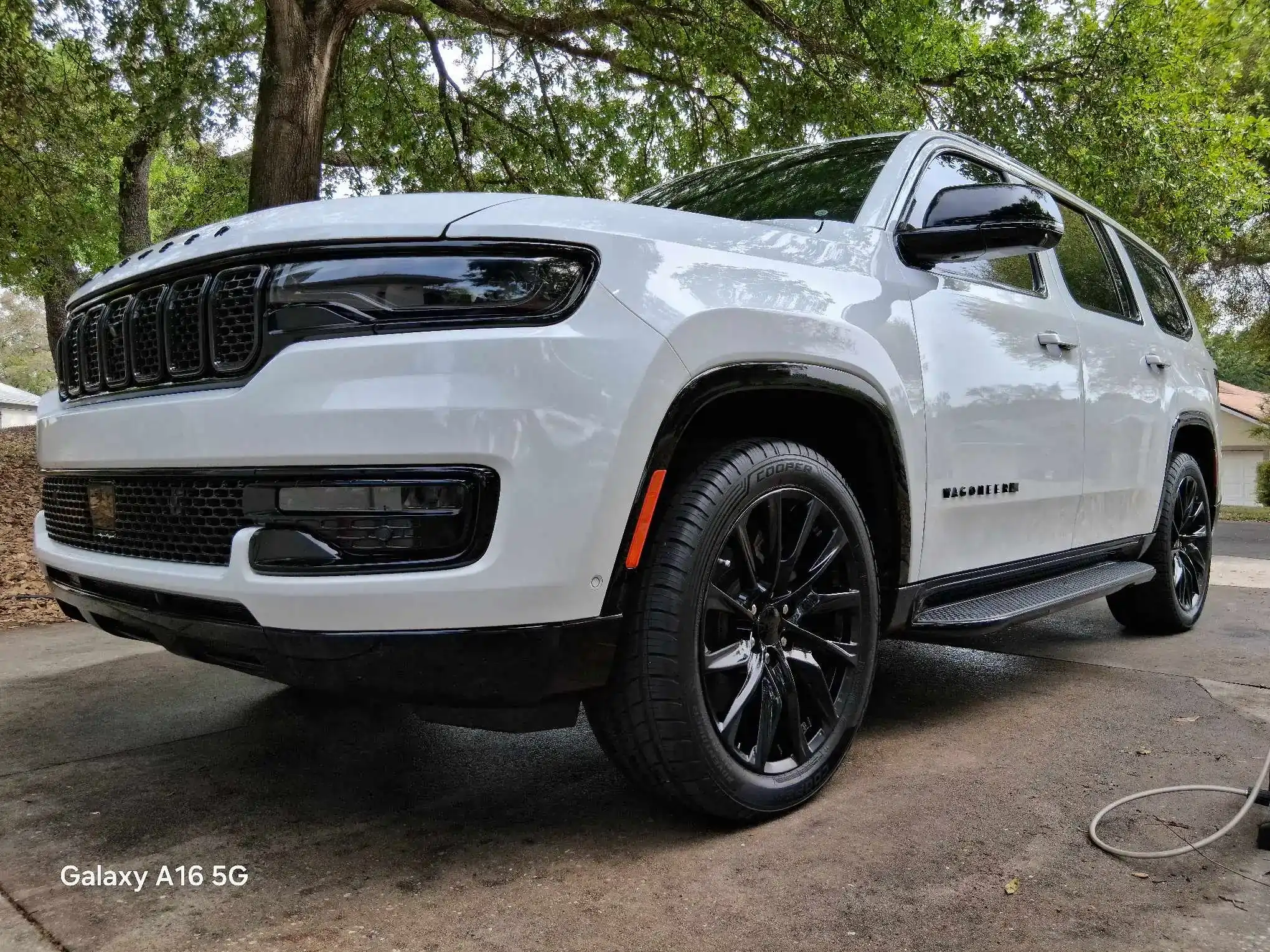 White Jeep Compass Altitude exterior detailing with ceramic coating and black accent wheels
